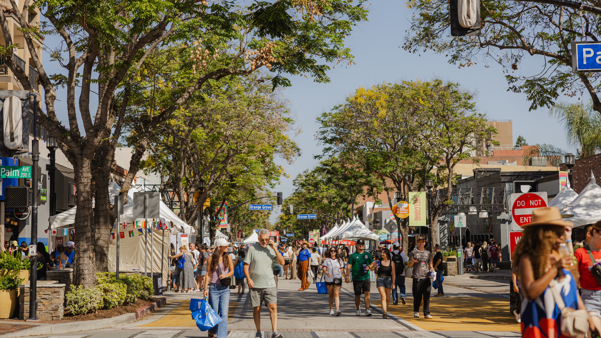 Crowds stroll the FIFA Fan Zone street fair in Downtown Burbank