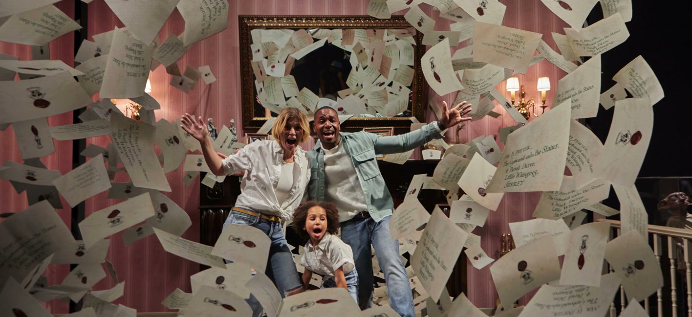 A family throws movie props in the air on a film set