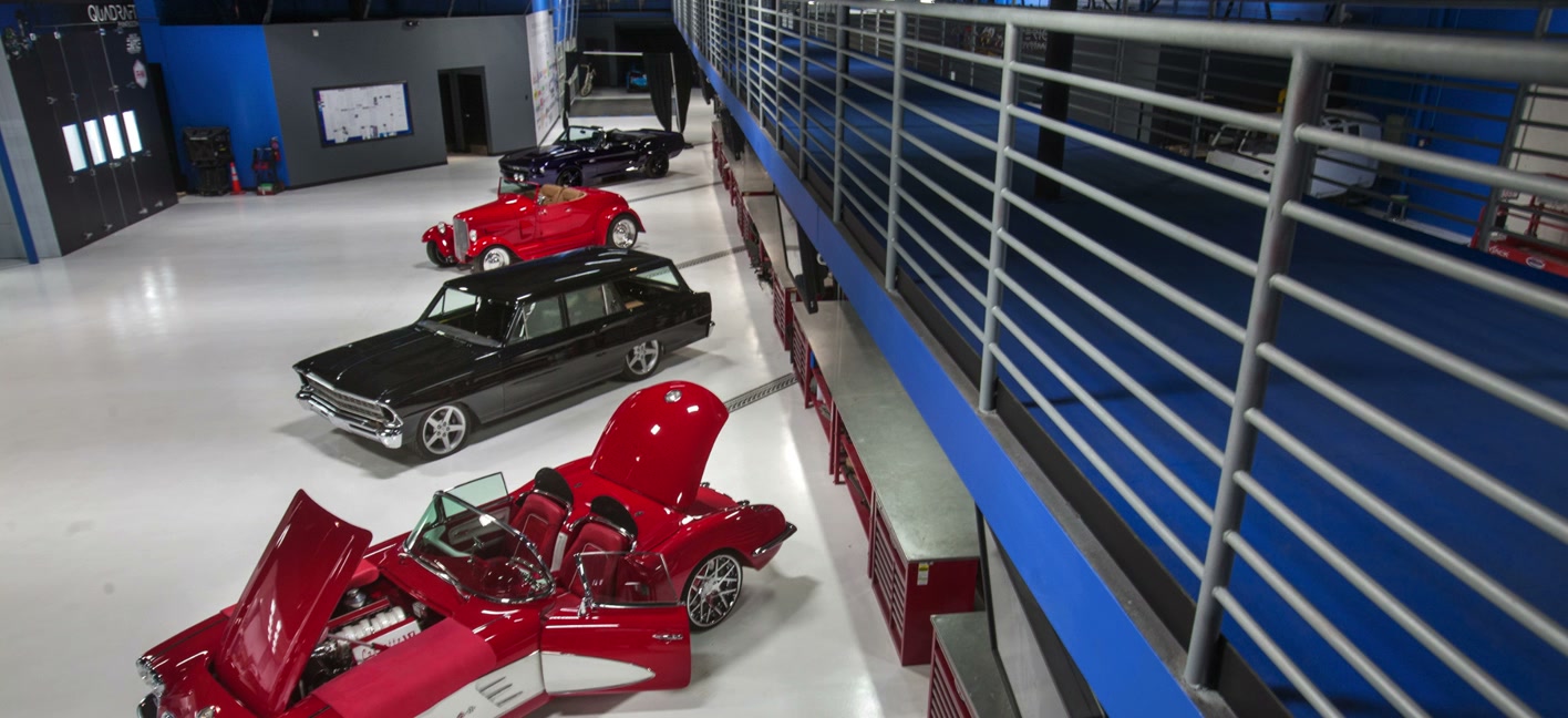 A classic car in a studio props garage