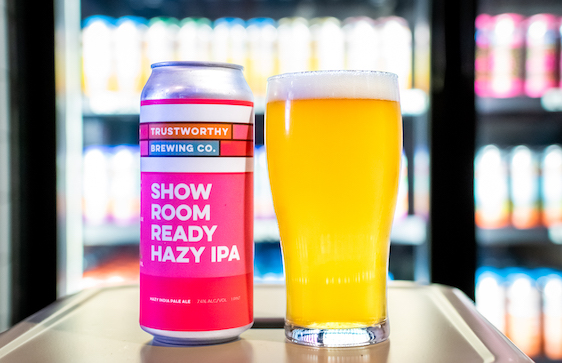 Trustworthy Brewing Co. beer can next to poured glass of beer
