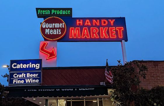 Handy Market sign at night