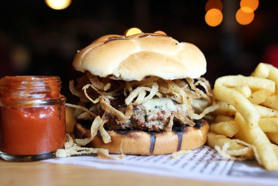 Tasty Burger with Fries and Red Sauce in a Glass Jar The Burbank Pub