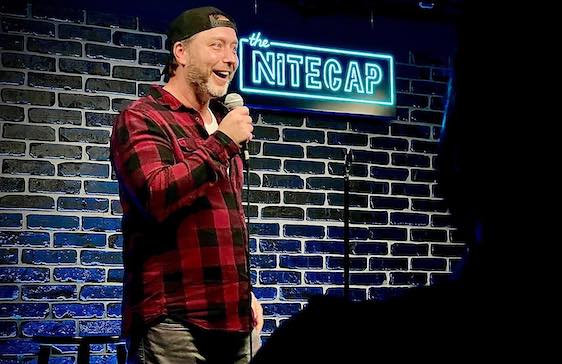 Comedian performing onstage at Nitecap LA