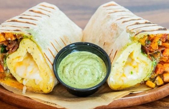 Wrap spit in half and show on a plate with green dip