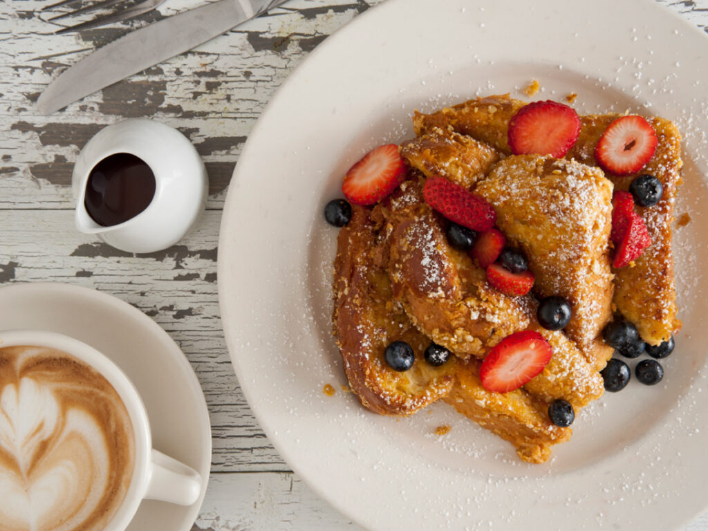 Bea Bea french toast with berries on a white plate