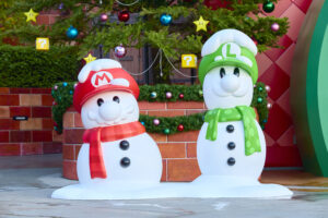 Mario and Luigi snowmen decorations with red and green hats and scarves