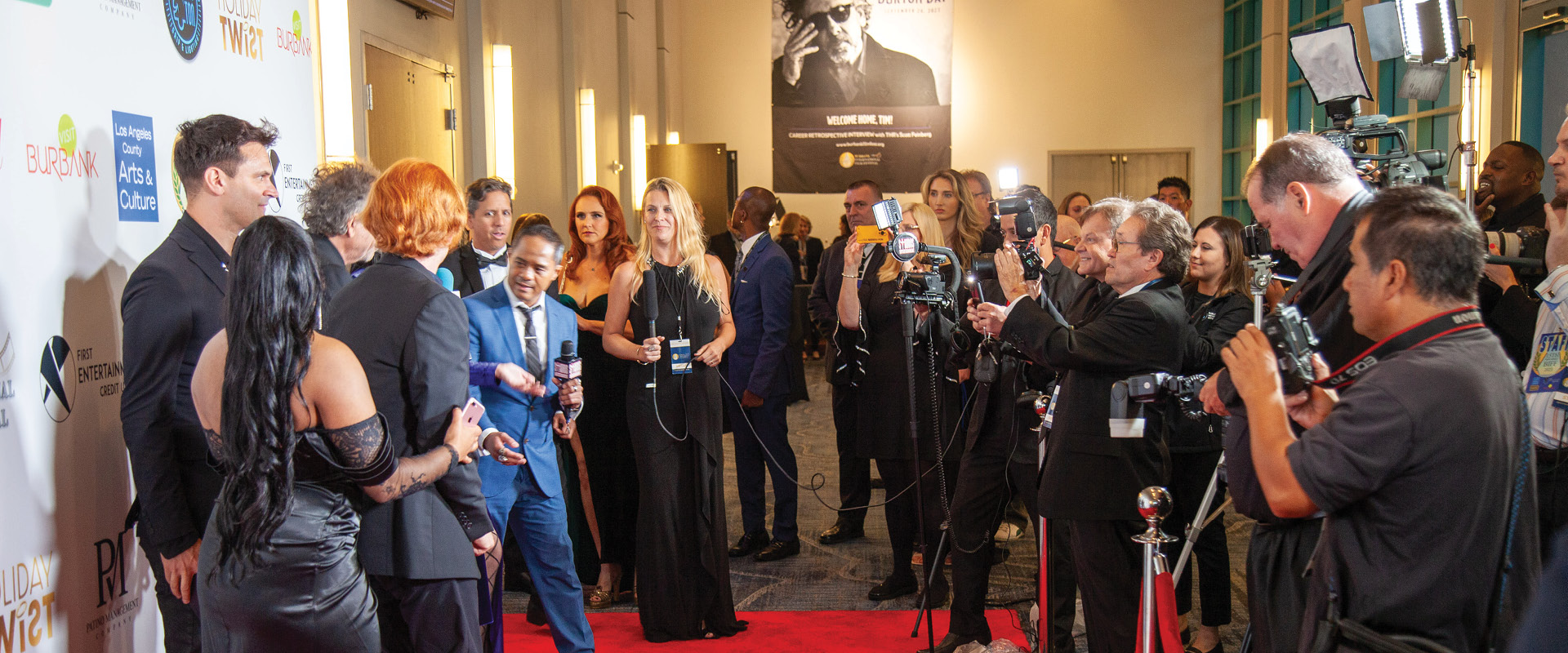 Guests and media on the red carpet at a Burbank entertainment industry event.
