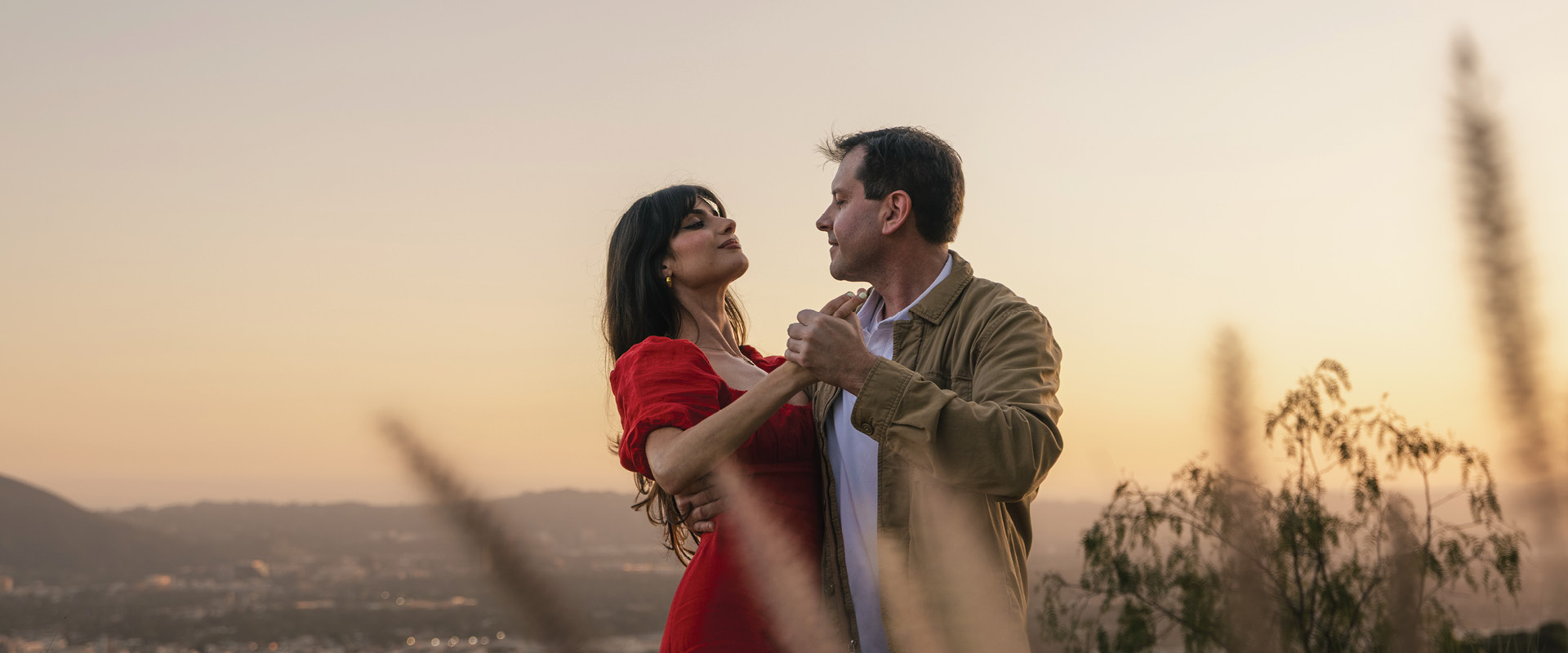 Couple dancing together at sunset overlooking Burbank.