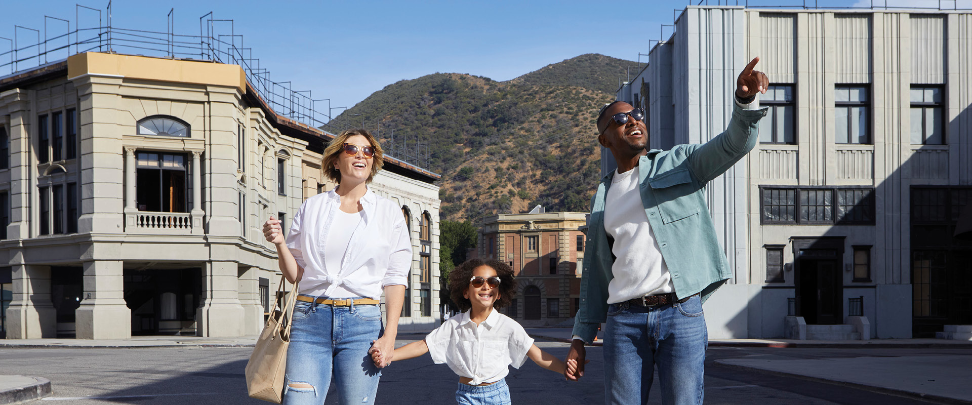 Family walking through the Warner Bros. Studio Tour backlot in Burbank.
