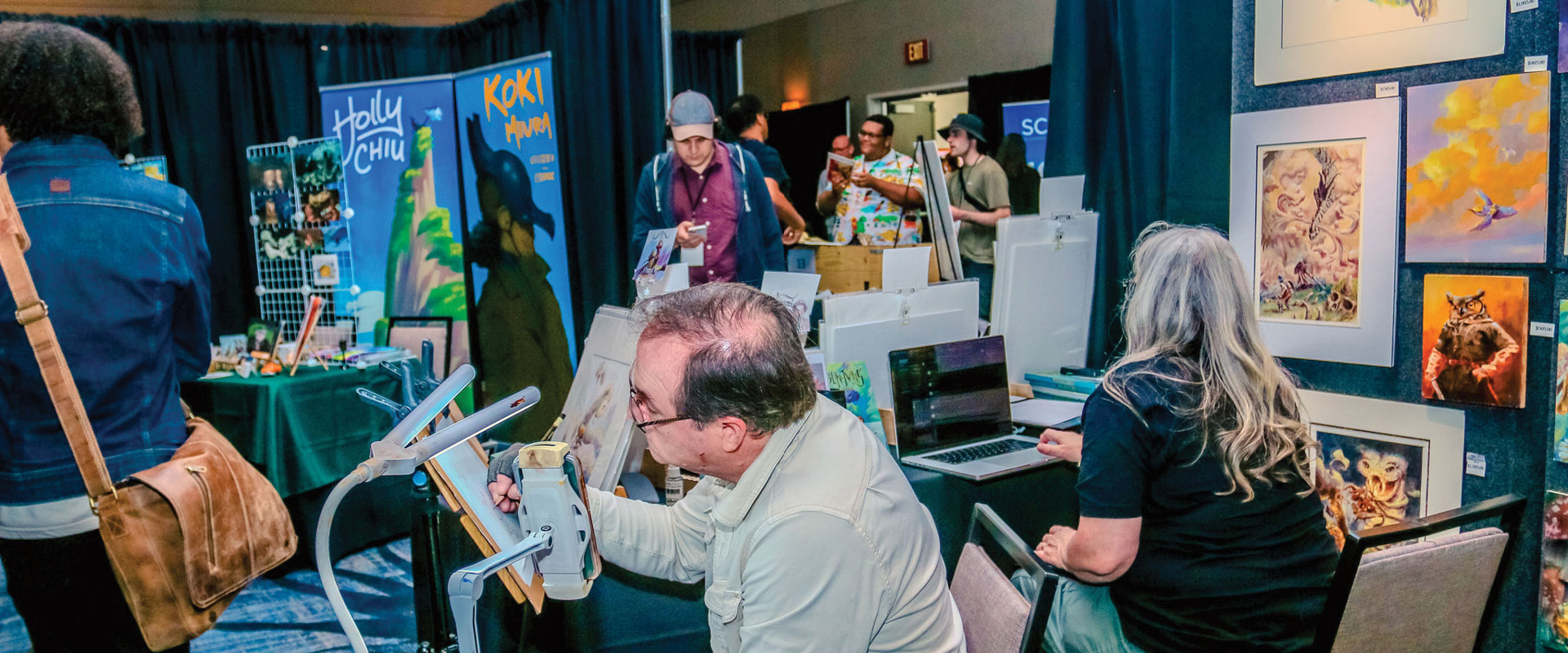 Artist creating an illustration at an art and comic convention in Burbank.