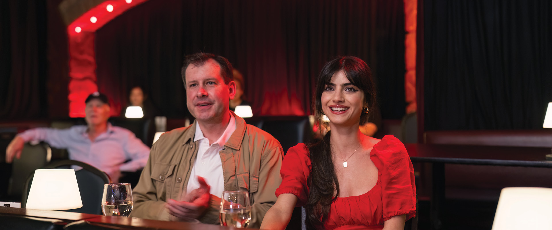 Couple enjoying a live performance at a theater in Burbank.