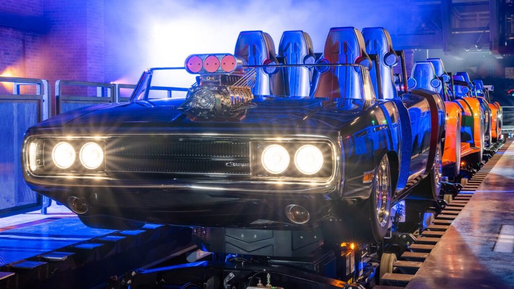 Dodge Charger ride vehicle lit in blue at the Fast & Furious: Hollywood Drift loading station